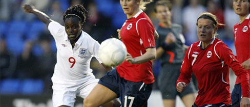 Eniola Aluko gets her shot away under pressure from the Norway defence.